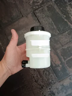 NISSAN NP200 BRAND POWER STEERING FLUID BOTTLES IN STOCK FOR SALE.