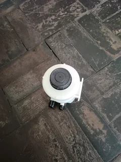 NISSAN NP200 BRAND POWER STEERING FLUID BOTTLES IN STOCK FOR SALE.