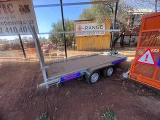 O-Range tandem axle ( un used) 4 ton Bobcat trailers