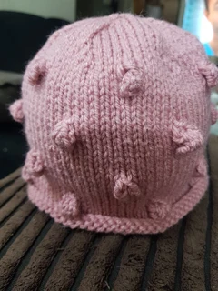 Hand knitted and crocheted baby blankets, jerseys, beanies and bootee