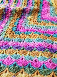 Hand knitted and crocheted baby blankets, jerseys, beanies and bootee