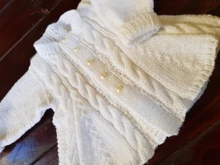 Hand knitted and crocheted baby clothing and blankets and more