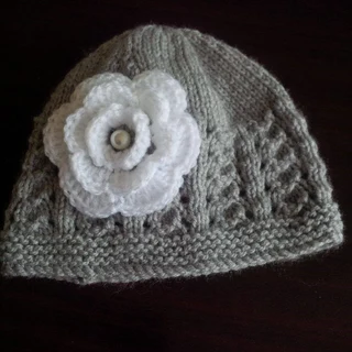 Crocheted and knitted baby dresses, jackets, jerseys, beanies, booties, blankets and more