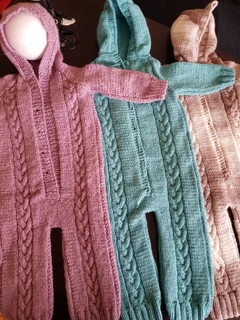 Crocheted and knitted baby dresses, jackets, jerseys, beanies, booties, blankets and more