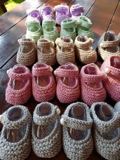 Hand knitted and crocheted baby garments and blankets