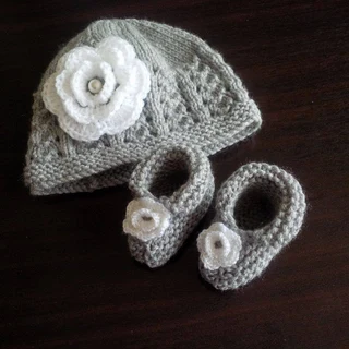 Hand knitted and crocheted baby garments and blankets