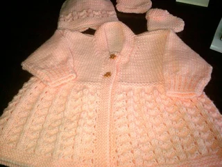 Hand knitted and crocheted baby garments and blankets
