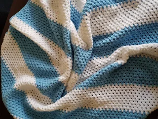 Hand knitted and crocheted baby wear and blankets of all sizes