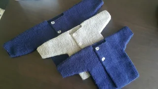 Hand crocheted and knitted baby garments and blankets of all shapes and sizes