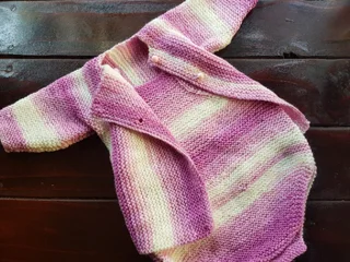 Hand crocheted and knitted baby garments and blankets of all shapes and sizes