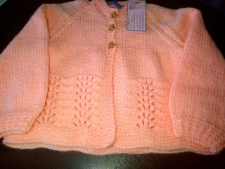 Hand crocheted and knitted baby garments and blankets of all shapes and sizes