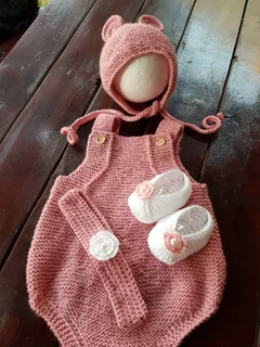 Hand crocheted and knitted baby garments and blankets of all shapes and sizes