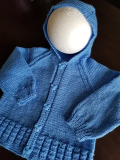 Hand crocheted and knitted baby garments and blankets of all shapes and sizes