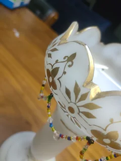 ANTIQUE MILK GLASS EPERGNE VASES, GOLD HAND PAINTED WITH BIDS.