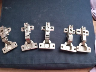 Collection of new and unused cabinet hingesAbout 10 in total completeSell the lot