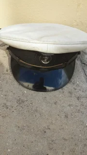 Old army helmet and navy cap and beret selling the lot