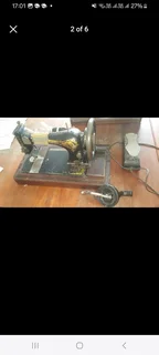 Singer sewing machine fully working on electric AND manual operation.Comes complete with pedal and