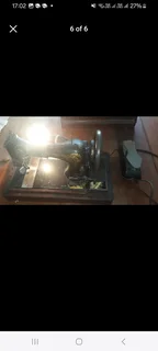 Singer sewing machine fully working on electric AND manual operation.Comes complete with pedal and