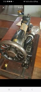 Singer sewing machine fully working on electric AND manual operation.Comes complete with pedal and
