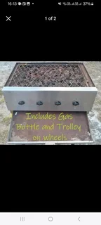 A four rail  burner stainless steel gas sizzle braai on stand vgc