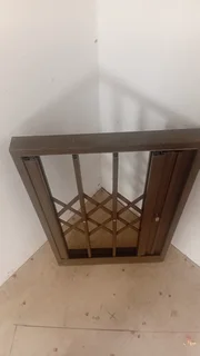 A trellidor expander for a window sized opening 50.5cm wide x 81cm  x 50mm thick  in vgc