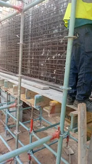 Concrete shuttering and steel reinforcement