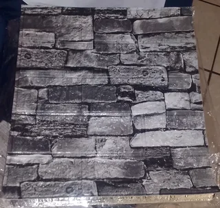 Selling 10 piece Grey   brick and wall  stick on tiles  size 35cmx38 cm .