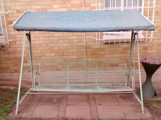 Garden swing chair with awning.