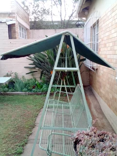 Garden swing chair with awning.