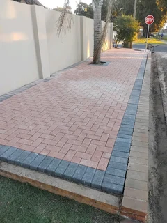 Red and charcoal colour paving