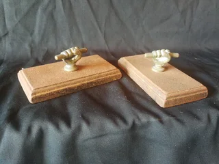 Victorian clenched fist cast iron and brass paperweights