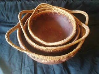 Vintage Indonesian wood and rattan bowl set