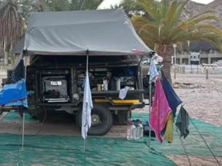 Howling Moon Trailer Tent Deluxe XT with Tailgate addition and sides for Tailgate and kitchen