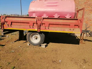 Tractor trailer almost new and plough for sale
