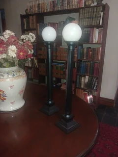 Large pair of black anodised candlesticks