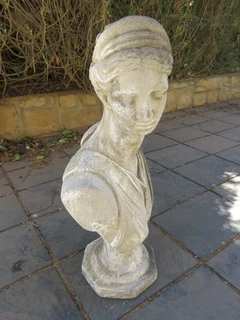 A concrete bust of a lady
