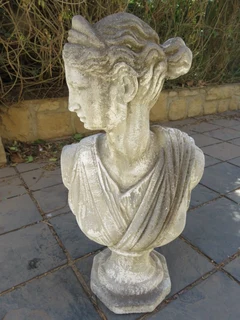 A concrete bust of a lady