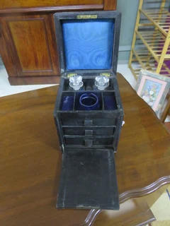 Victorian jewelry box with glass perfume bottles