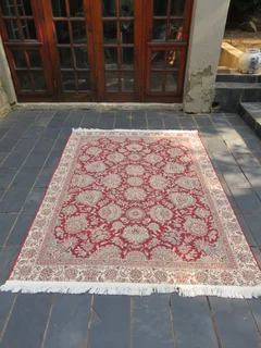 A Persian design Kelim carpet.