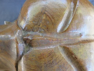 Carved wooden weeping buddha