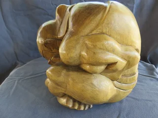 Carved wooden weeping buddha