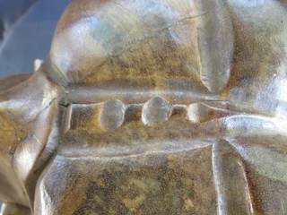 Carved wooden weeping buddha