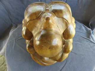 Carved wooden weeping buddha