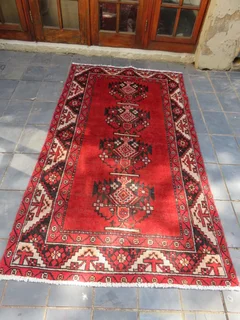 A Persian hand knotted Kordi rug.