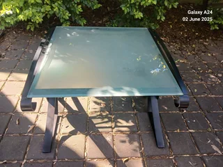 Wrought iron and opaque glass side table