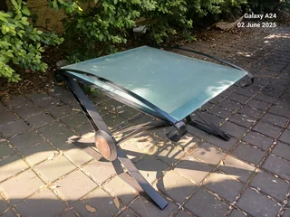 Wrought iron and opaque glass side table