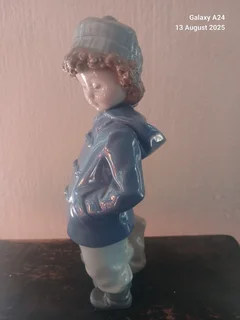 Nao figurine of a boy holding a bag #1036