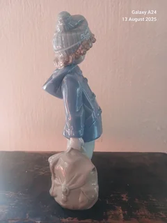 Nao figurine of a boy holding a bag #1036