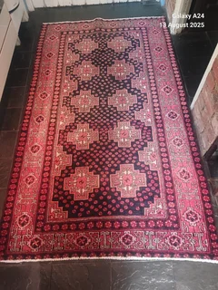 A Persian hand knotted Beluchi rug