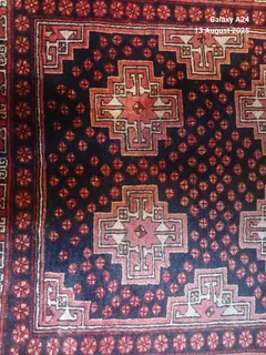 A Persian hand knotted Beluchi rug